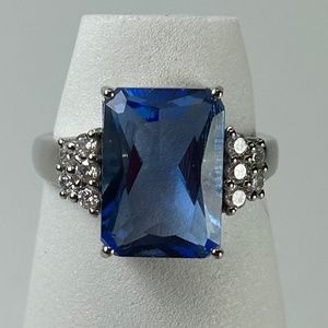 Sterling silver emerald cut lab created Ceylon sapphire with side white sapphire